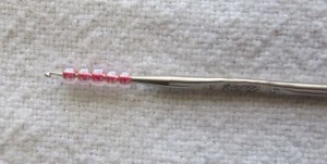 Using a crochet hook for knitting with beads