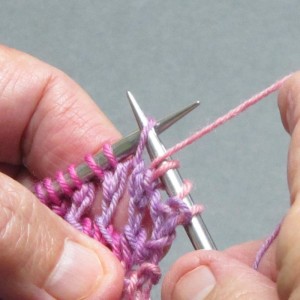 Insert right-hand needl through next stitch purlwise.