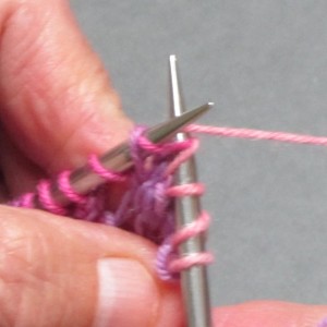 Knit the second stitch as usual, wrapping yarn around needle counter-clockwise.
