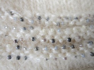 Beads sparkle amidst the soft halo of brushed mohair