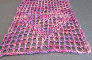 filet lace knitting in variegated wool yarn