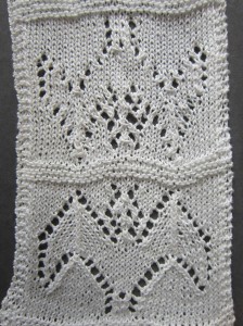 Barbara Walker's lace bat  - as per original instructions on bottom; knitted with rows in reverse order on top