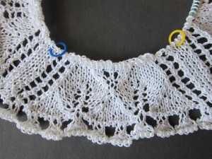 center area in progress showing a triangular section between stitch markers